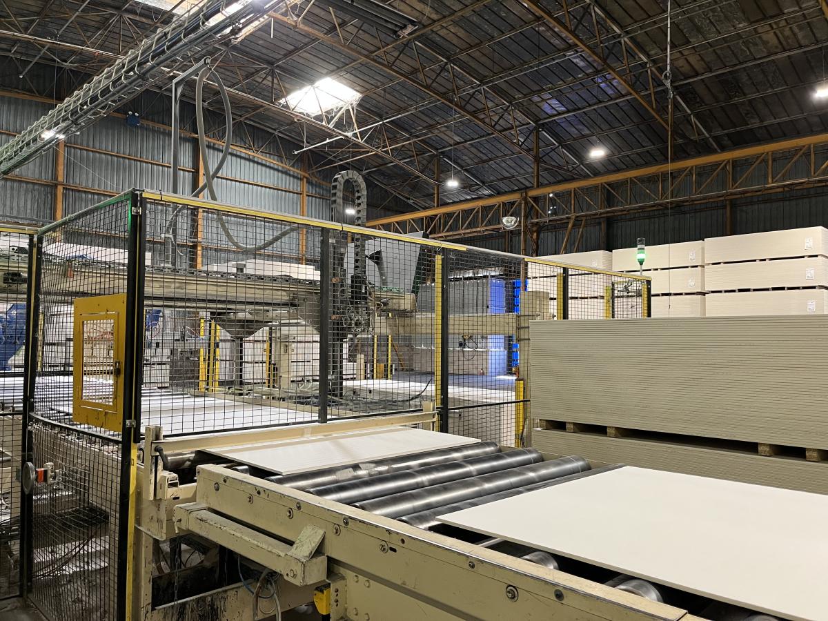 Recovered office partition components stored at Clipper Coramine's facility prior to reuse in a circular office retrofit.