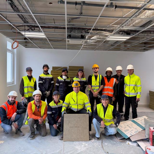French Demonstrator ceiling tiles installation team.
